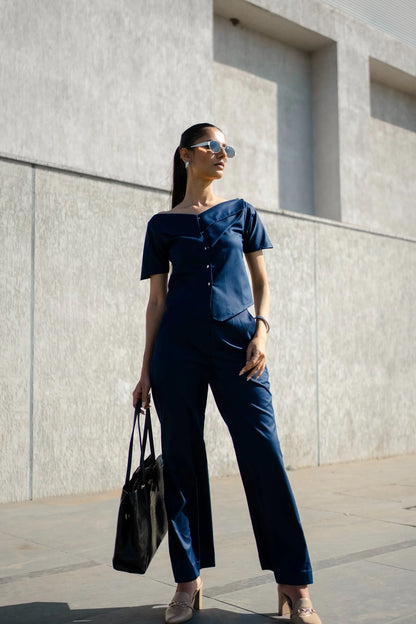, MidWeek Women's Formal Wear - Workwear Style India, Woman in a navy outfit standing against a light gray wall.