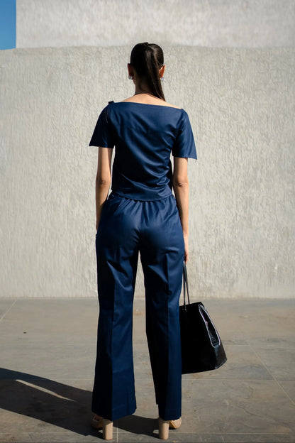 , MidWeek Women's Formal Wear - Workwear Style India, Woman wearing a navy blue outfit standing against a light-colored wall.