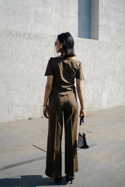 , MidWeek Women's Formal Wear - Workwear Style India, Woman in a brown outfit walking on a street with a white wall in the background