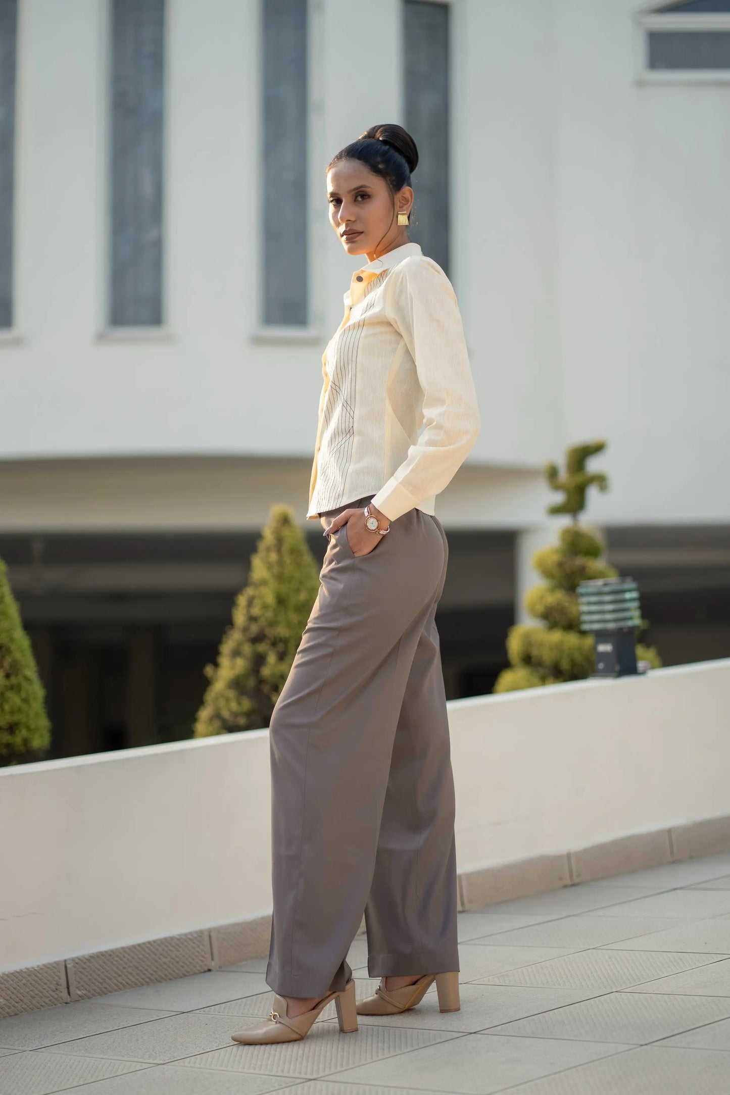 Unbounded Stitch Mauve Set, MidWeek Women's Formal Wear - Workwear Style India, Woman in a white blouse and gray pants standing on a rooftop with a blurred building background