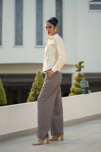 Unbounded Stitch Mauve Set, MidWeek Women's Formal Wear - Workwear Style India, Woman in a white blouse and gray pants standing on a rooftop with a blurred building background